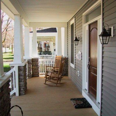 Front porch with stone piers and wood columns