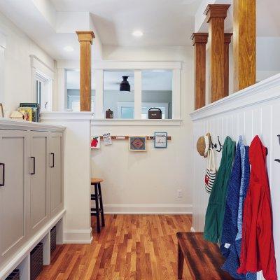 Coats on hooks and storage cabinets Wilcox Architecture